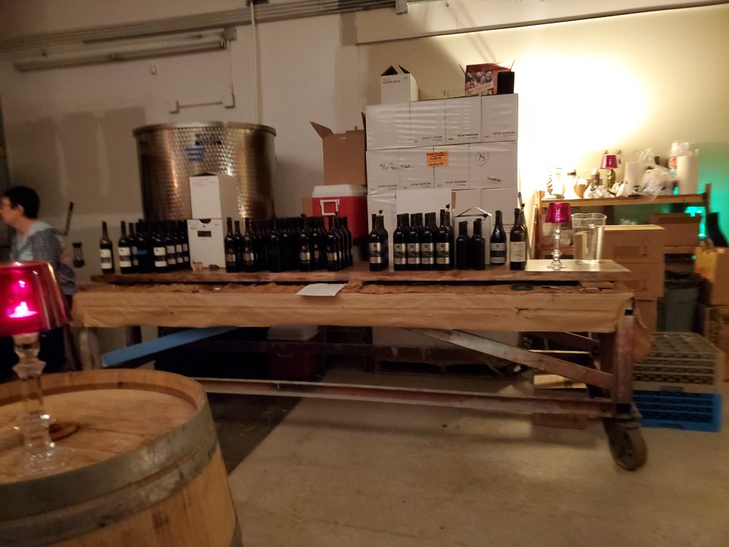 A photo of a table with wine bottles on it, all of the wines we'd be sampling that day.